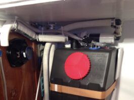 Misirlou’s gravity drain holding tank mid-installation showing tank valve, Tee to deck pump-out fitting and home-made activated charcoal vent filter. (Photo/ Tom Egan)